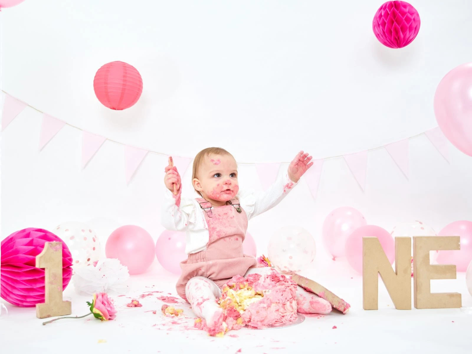 Excited 1 year old smashing cake